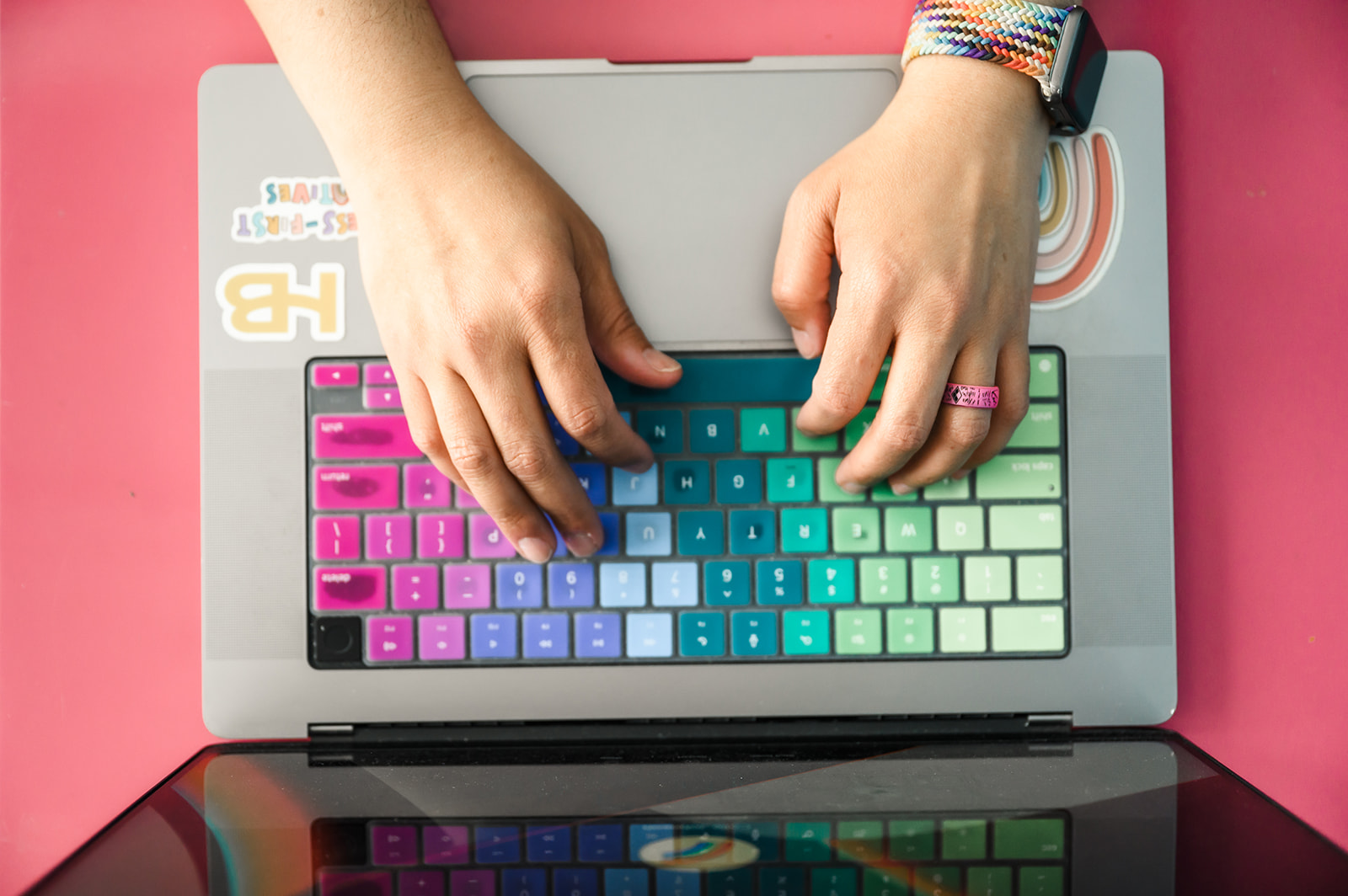 Colie James typing a blog about the best Dubsado templates for designers