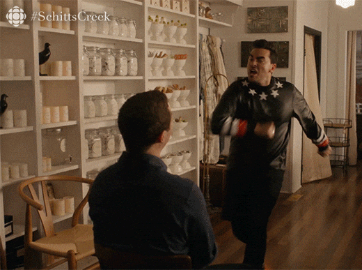 David from Schitt's Creek points and sings "You're simply the best" to Patrick, celebrating the results Kelley got from her new client offboarding process.